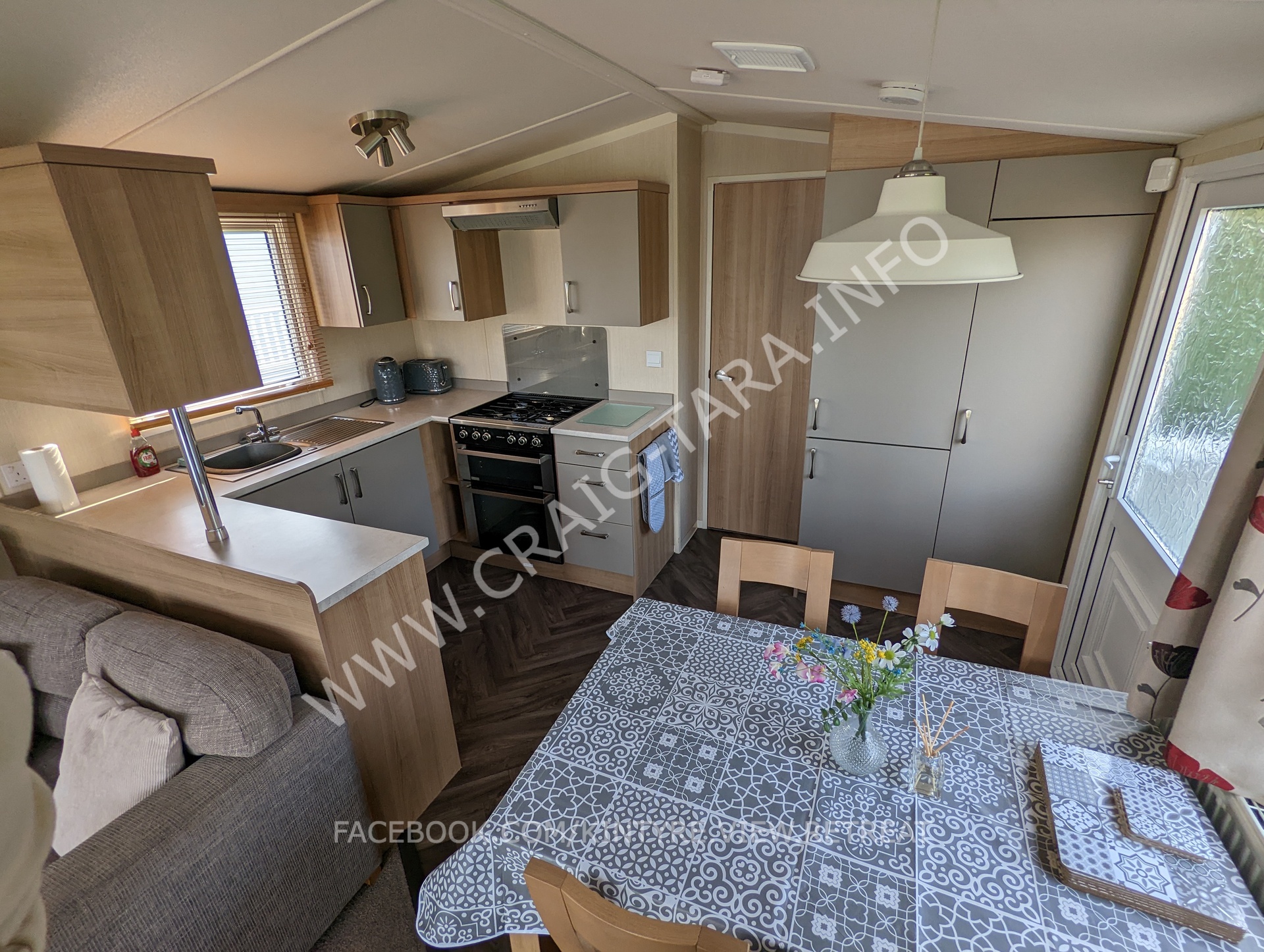 kitchen and dining area with full sie fridge freezer